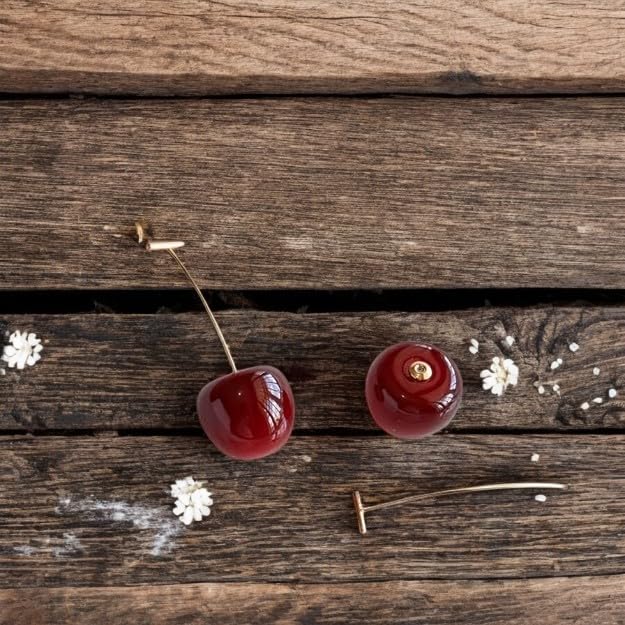 AVIGHNA's Trendy Round Korean Red Cherry Gold Plated Stem Dangle Earrings and these earrings offer a perfect blend of whimsy and sophistication. Whether for everyday wear or special occasions, these earrings will brighten your style with a pop of color an